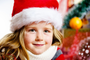 Cute little girl in red santa hat christmas portrait