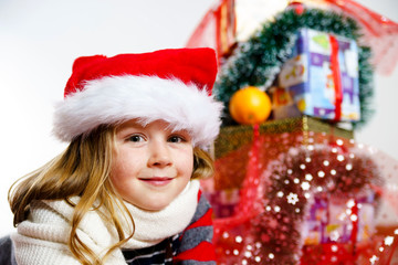 Cute little girl in red santa hat christmas portrait