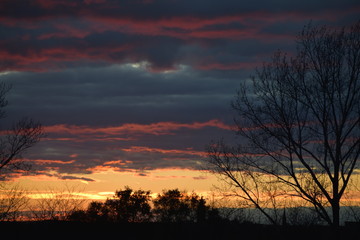 Sunset surrounded by colorful clouds