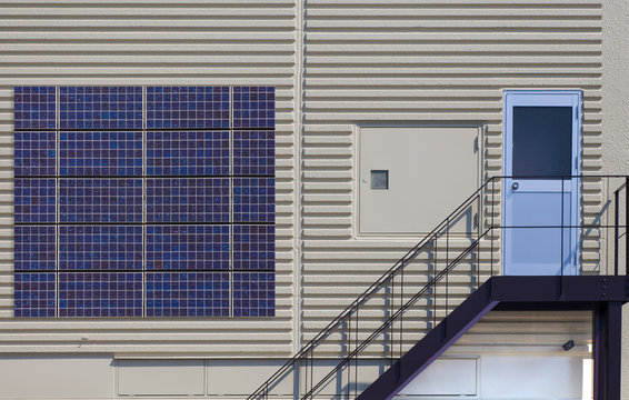 Solar panel on factory concrete wall background