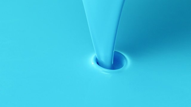 Pouring blue paint into blue paint shooting with high speed camera.