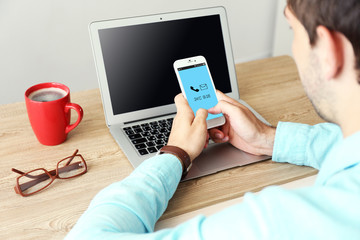 Man using mobile phone in office