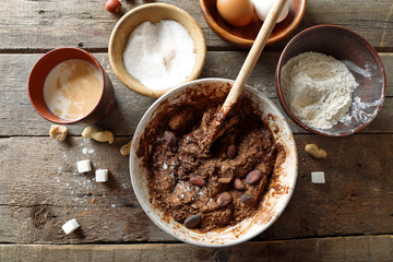 Preparing dough for chocolate pie on table close up
