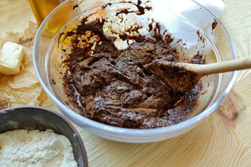 Preparing dough for chocolate pie on table close up