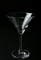 Empty glass on black background