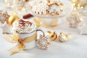 Beautiful composition with cup of cappuccino and Christmas cookies