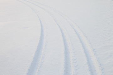 Car tire track in snow