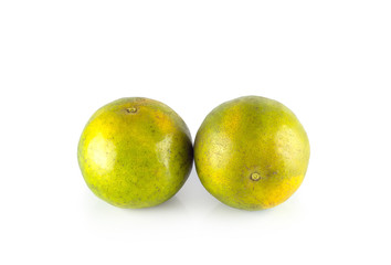 Two green tangerine, isolated on white background