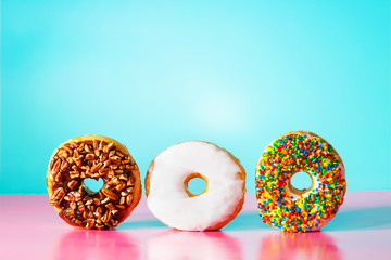 Donuts on pastel blue and pink background