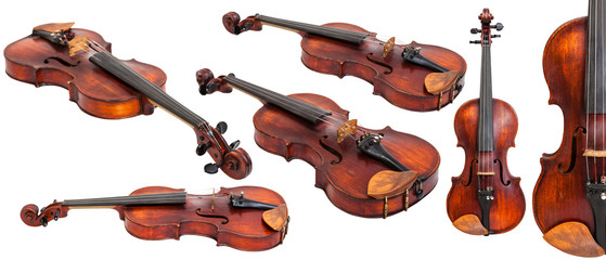set of old violins isolated on white © vvoe