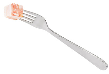 dinning fork with piece of lard isolated