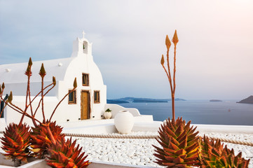 Church in Oia town, white architecture on Santorini island, Gree