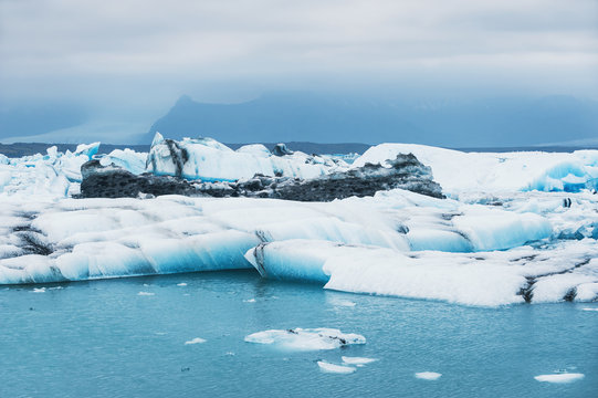 Beautiful blue icebergs in Jokulsarlon glacial lagoon.