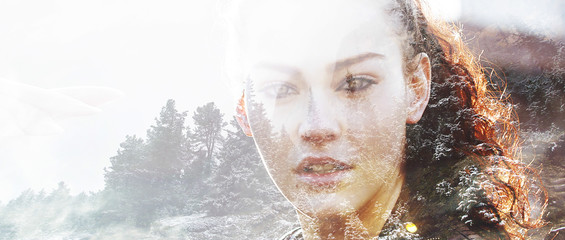 Double exposure of girl with gorgeous eyes and winterscape lette