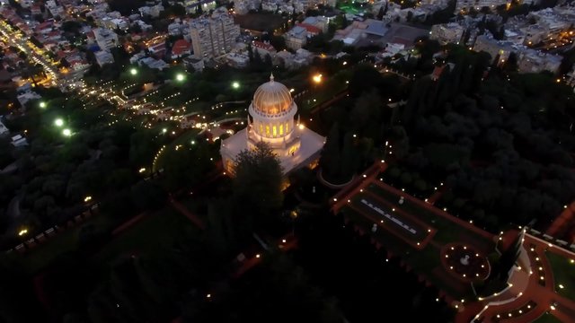 Bahai temple and gardens - 360 aerial around the golden dome night aerial footage