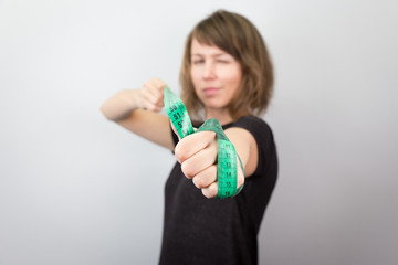 Young woman model measuring meter bow diet studio.