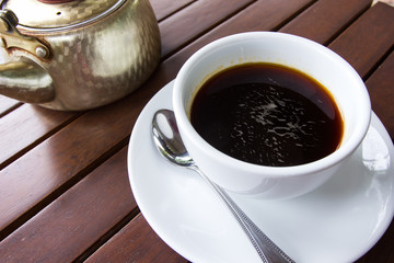 Black coffee on wooden borad