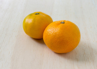 Orange on the white wood