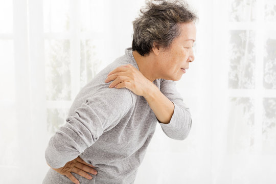 senior woman suffering in shoulder pain