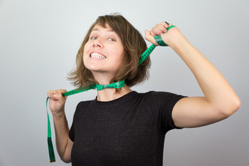 Woman model hanging choking measuring neck meter tape diet.