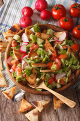 Vegetable salad with pita close up in a bowl. Vertical
