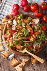 Vegetable salad with pita close up in a bowl. Vertical
