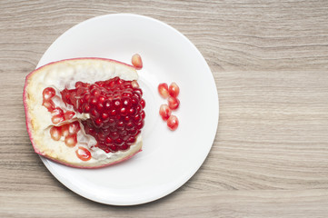 One part of the garnet on the white plate.