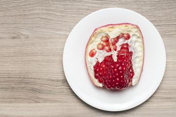 One part of the garnet on the white plate.