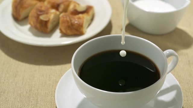 Pouring milk into coffee shooting with high speed camera, phantom flex.