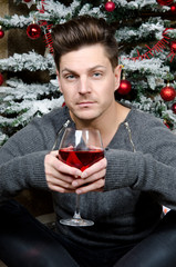 a man at a Christmas tree 