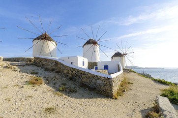 Three windmills in Chora,Mykonos,Greece.Traditional greek whitewashed architecture,a popular landmark,tourist destination on the island of winds,deep blue sky,Aegean sea. Wind mills are now decorative © f8grapher