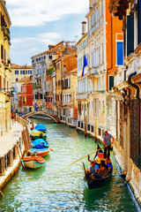 Tourists traveling in gondola, Rio Marin Canal, Venice, Italy © efired