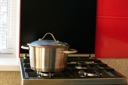 stainless saucepan on a gas stove