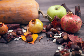 Autumn fruits on a wooden table