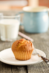 sweet muffin on old wooden table