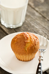 sweet muffin on old wooden table