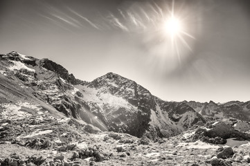 Obraz premium the last sun on the rop of the mountain in italy