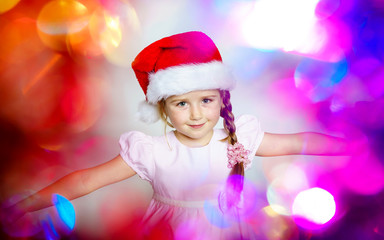 Pretty little girl dressed in santa red hat, new year portrait w