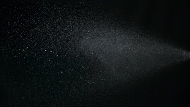 Spraying and cleaning  on black background shooting with high speed camera, phantom flex.