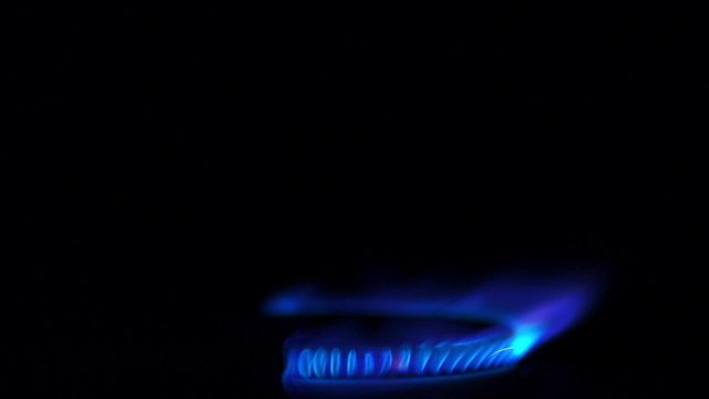 Turning on gas stove on black background shooting with high speed camera, phantom flex.