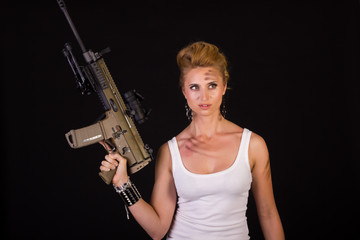 Fototapeta premium sexy blonde woman with gun