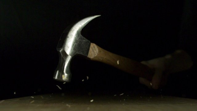 Hammering nail on wood panel shooting with high speed camera, phantom flex.