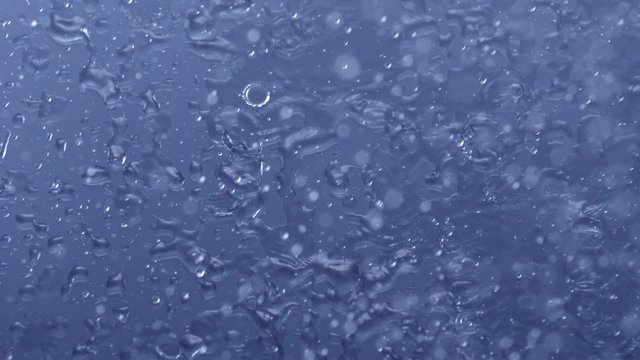 Heavy rain on window glass shooting with high speed camera, phantom flex.
