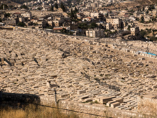 JERUSALEM, ISRAEL - July 13, 2015: Old jewish graves on the mount of olives in Jerusalem, with on...