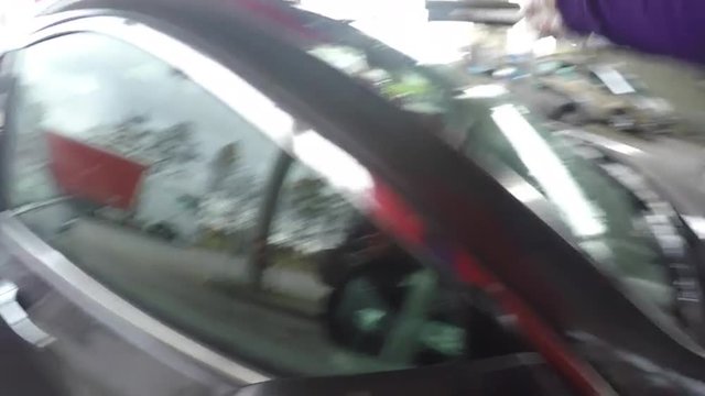 Wiping car window at the gas station