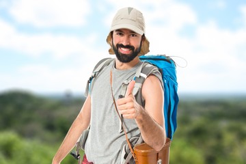 Fototapeta premium Man with thumb up over white background