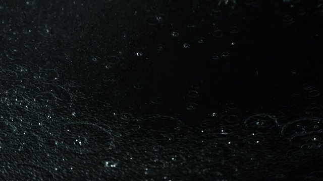 Water drop and ripple on black background shooting with high speed camera, phantom flex.