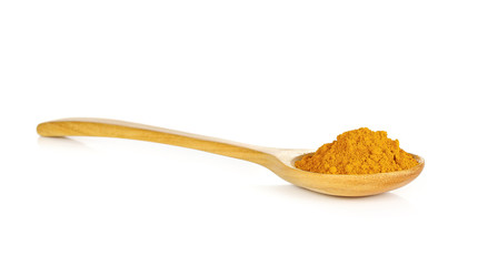 yellow turmeric in wooden spoon on white background