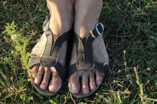 Feet girl in sandals