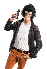 Monkey man holding a pistol © luismolinero